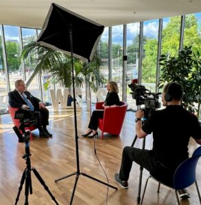 Gillian Millar conducting an interview at the WSIS +20 event in Geneva, Switzerland